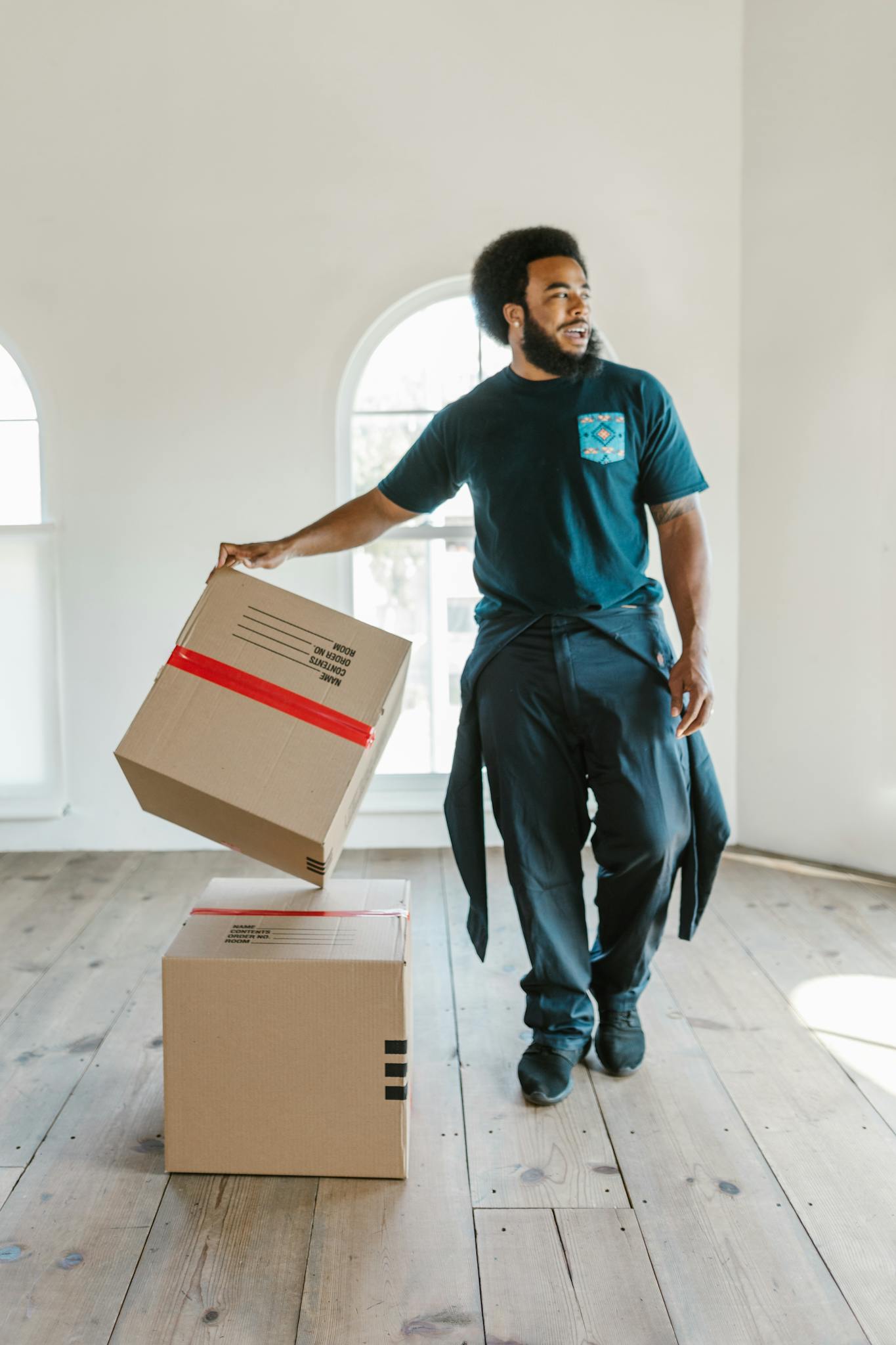 a mover carefully handles boxes in a